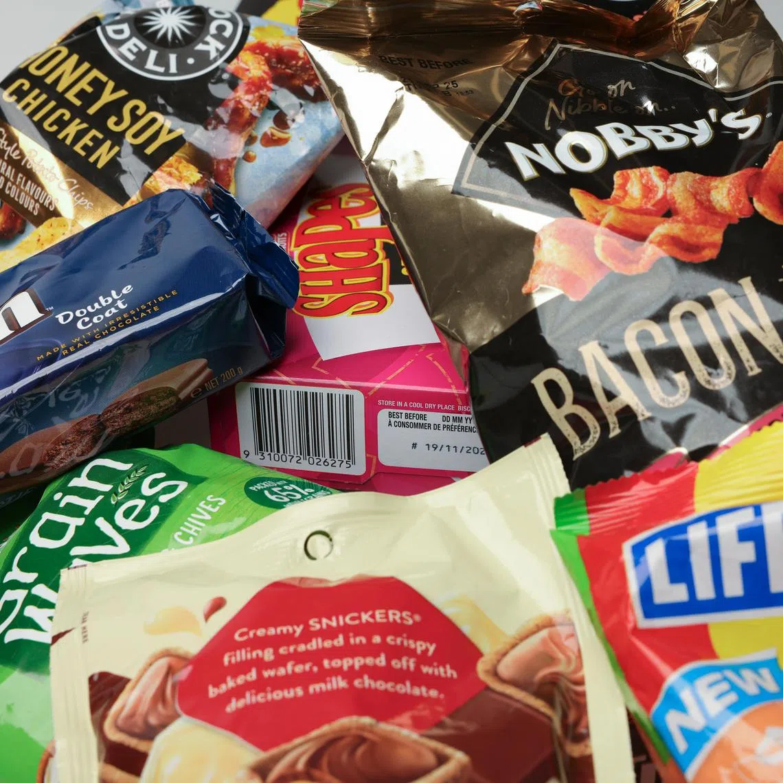 Popular snacks in Australia can be found in local supermarkets like Coles and Woolsworth. 