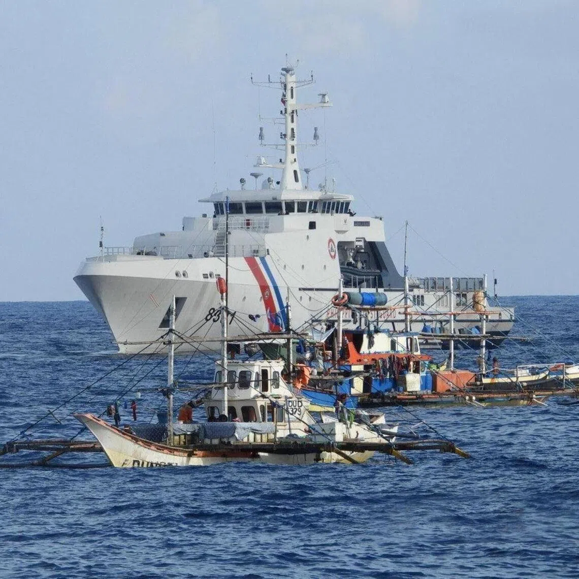 A Philippine Coast Guard vessel was among the government ships sending supplies to 40 Filipino fishing boats at Scarborough Shoal in the disputed South China Sea on September 16, 2025. 