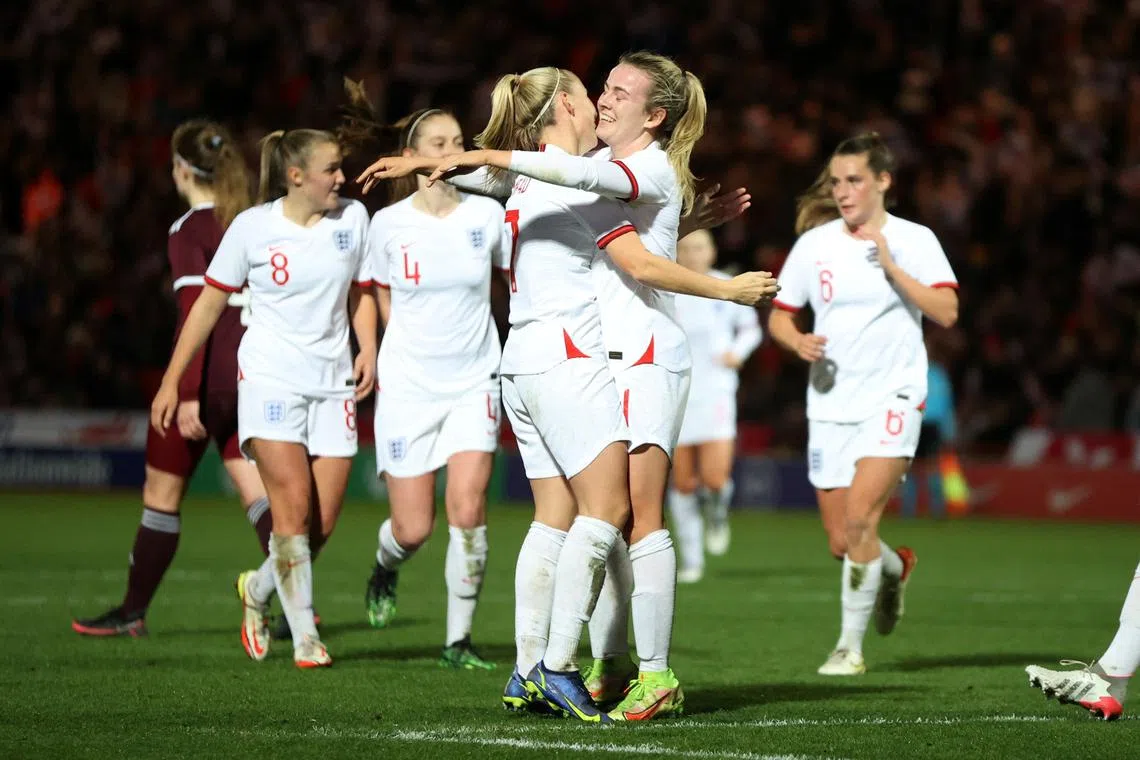 FILE PHOTO: Soccer Football - Women's World Cup Qualifier - Group D - England v Latvia - Keepmoat Stadium, Doncaster, Britain - November 30, 2021 England's Lauren Hemp celebrates scoring their eighth goal with teammates Action Images via Reuters/Molly Darlington/File Photo