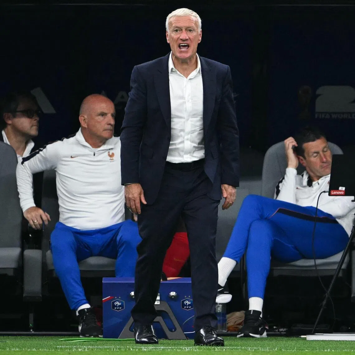 France's head coach Didier Deschamps (C) reacts in the techinal area during the 2026 World Cup football tournament semi-final match between France and Spain at the Dallas Stadium in Arlington on July 14, 2026.  (Photo by RONALDO SCHEMIDT / AFP)
