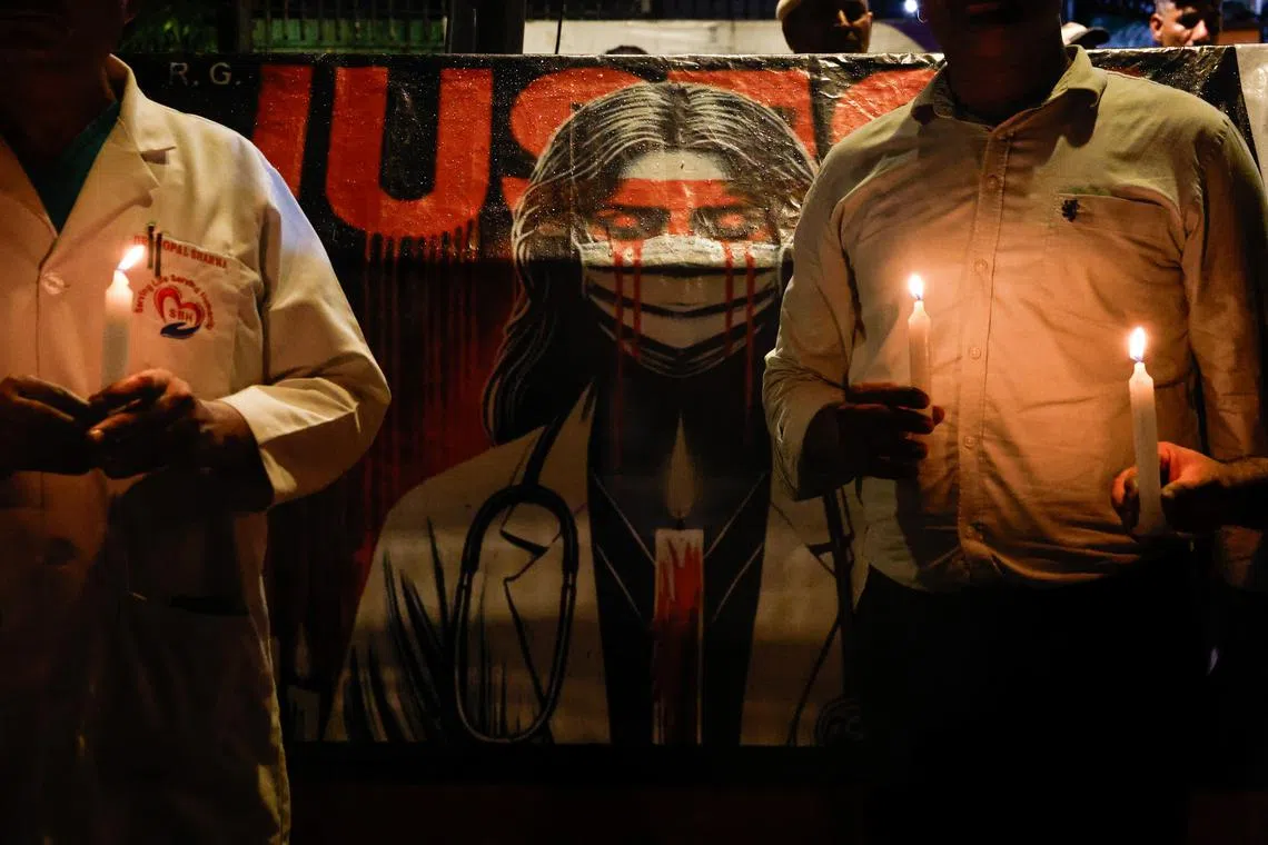 FILE PHOTO: Doctors hold candles during a protest rally demanding justice, following the rape and murder of a trainee medic at a hospital in Kolkata, in New Delhi, India, August 16, 2024. REUTERS/Priyanshu Singh/File Photo