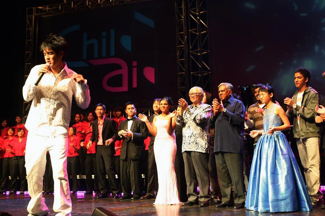 [Nathan Hartono (left), 15, singing at the ChildAid concert, showcasing Singapore's young musical talents. The concert was organised by The Straits Times and The Business Times, raising $335,000 
for the ST School Pocket Money and BT Budding Artists funds. Last night was for corporate sponsors and invited guests, with President S R Nathan as the guest of honour and it was held at the University Cultural Centre. ]