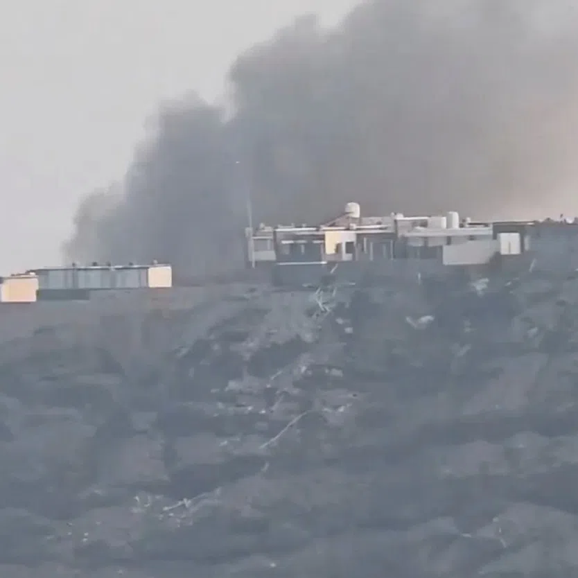 Smoke billowing from the presidential palace complex following an attack by the Houthis, in Aden, Yemen, on Oct 15.
