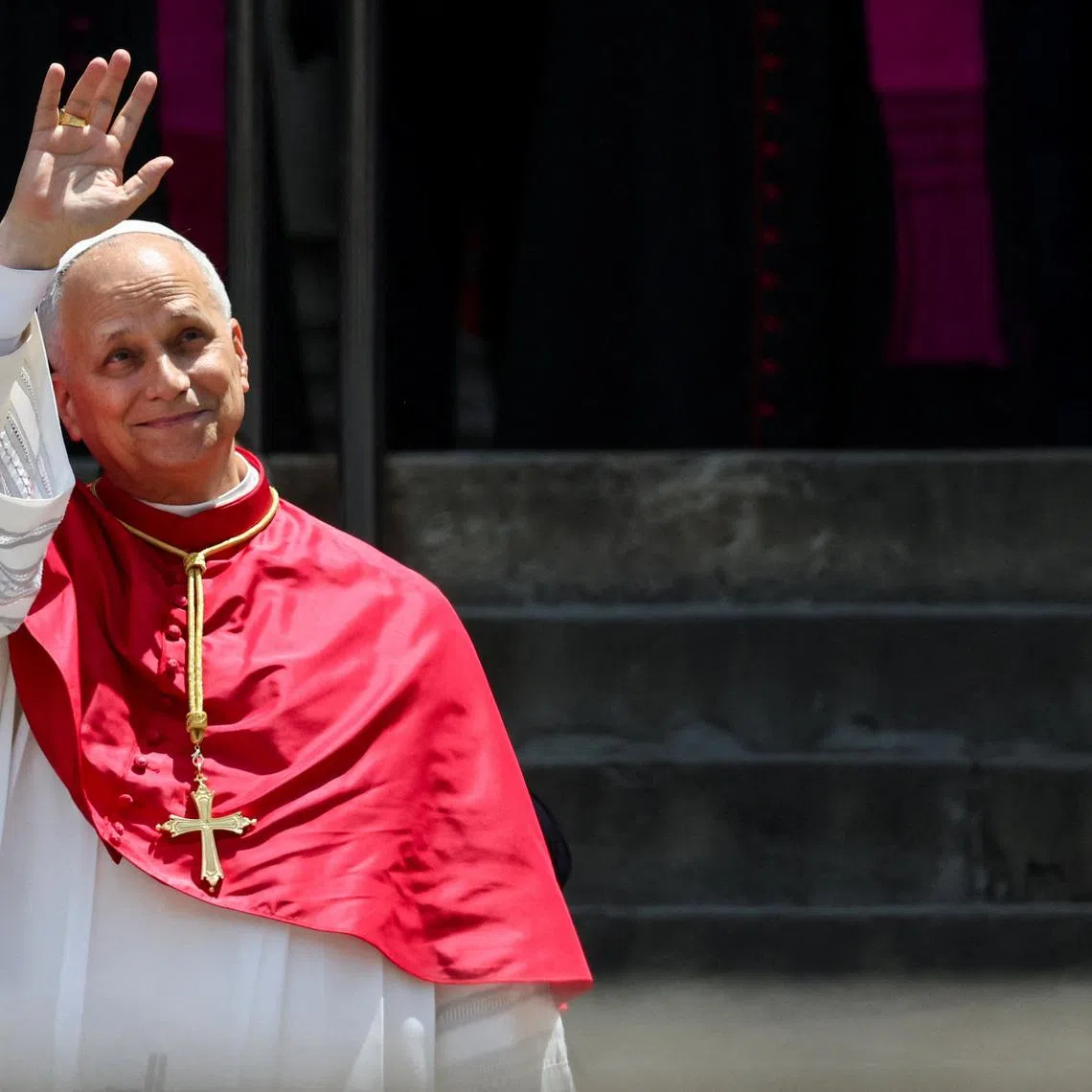 Pope Leo XIV waves to the faithful outside the Cathedral of the Holy Cross and Saint Eulalia after attending midday prayers, during his apostolic journey, in Barcelona, Spain, June 9, 2026. REUTERS/Yara Nardi
