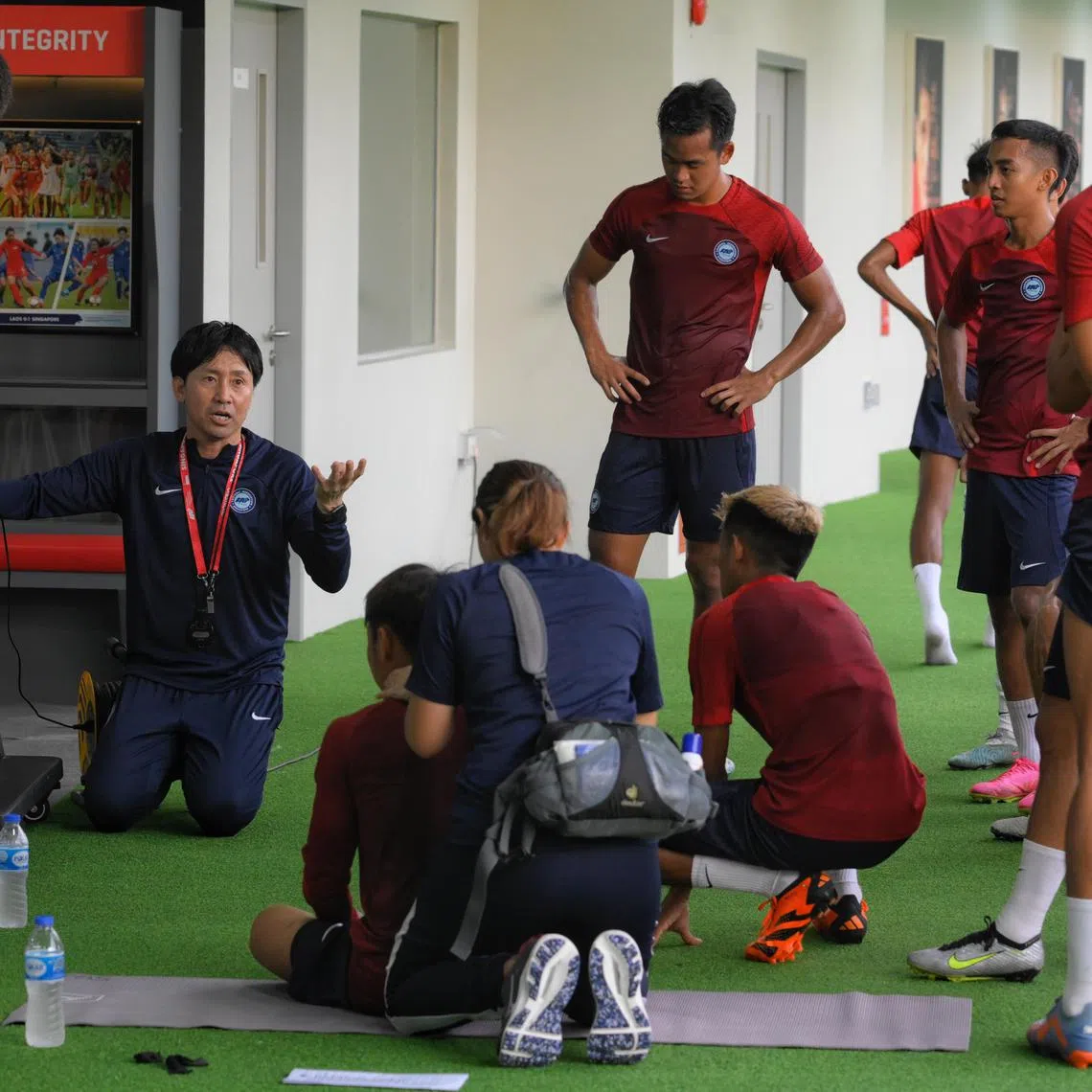 Singapore head coach Takayuki Nishigaya (left) coaches the national football team at Kallang Football Hub on June 12, 2023.
