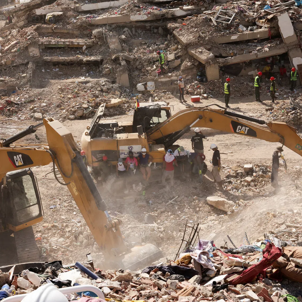 People search for the bodies of their loved ones beneath the rubble, after earthquakes rocked Venezuela on June 24, killing and displacing thousands of people, in Caraballeda, La Guaira, Venezuela, July 29, 2026. REUTERS/Gaby Oraa