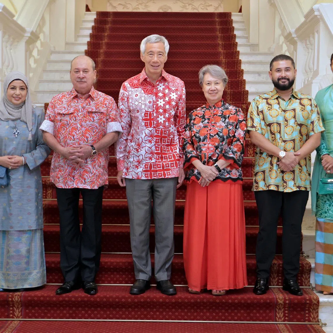 Prime Minister Lee Hsien Loong and his wife Ho Ching (centre) welcome Johor's Sultan Ibrahim Iskandar (on Mr Lee's right) and Queen Raja Zarith Sofiah, and Johor Crown Prince Tunku Ismail Ibrahim and his wife Che’ Puan Besar Khaleeda, at the Istana on Tuesday.