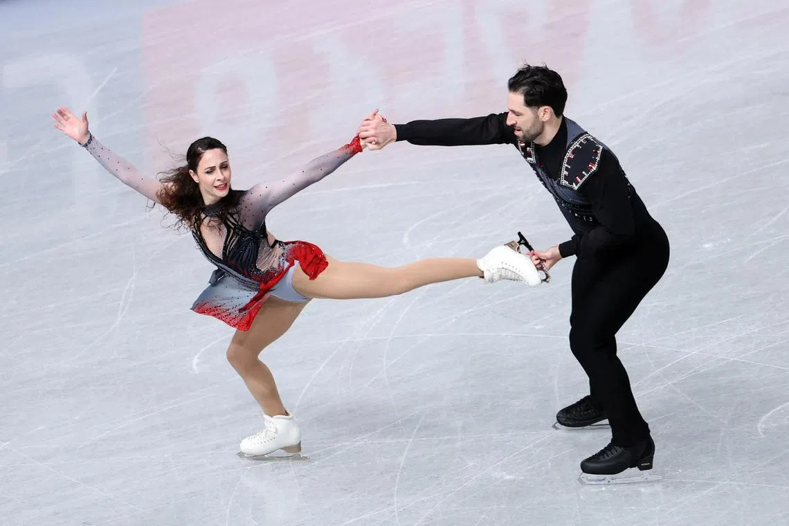 Figure Skating - ISU Grand Prix of Figure Skating - Grand Prix Final - Aichi International Arena, Nagoya, Japan - December 4, 2025 Canada's Deanna Stellato-Dudek and Maxime Deschamps perform during the pairs short program REUTERS/Issei Kato