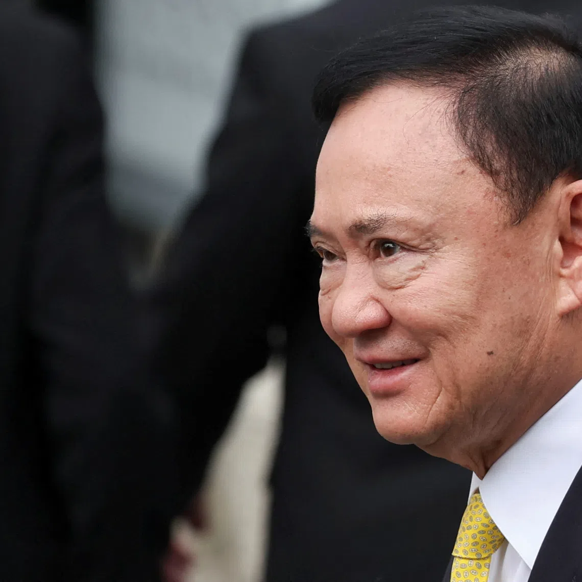 Former Thai Prime Minister Thaksin Shinawatra arrives at the Supreme Court ahead of a verdict on the legality of his six-month hospital stay before he was granted a parole, in Bangkok, Thailand, September 9, 2025. REUTERS/Chalinee Thirasupa