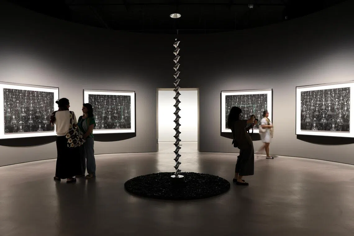 ST20260526_202660800933/Sarah Lee/cxart

Generic photo of Hiroshi Sugimoto's Mathematical Model 002: Dini’s Surface (2005, spiral sculpture) and Sea of Buddha (1995, photographs on wall), as part of Hiroshi Sugimoto: Form Is Emptiness, the artist's first solo exhibition in Southeast Asia, at the Singapore Art Museum. Photographed on May 26, 2026. ST PHOTO: SARAH LEE