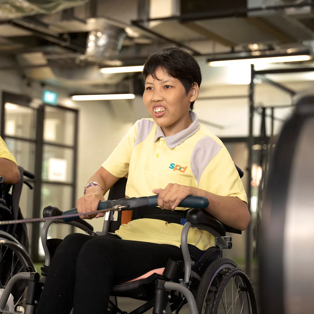 Regular exercise sessions organised by the SPD Day Activity Centre help Ms Veronica Tan work on her physical mobility. 