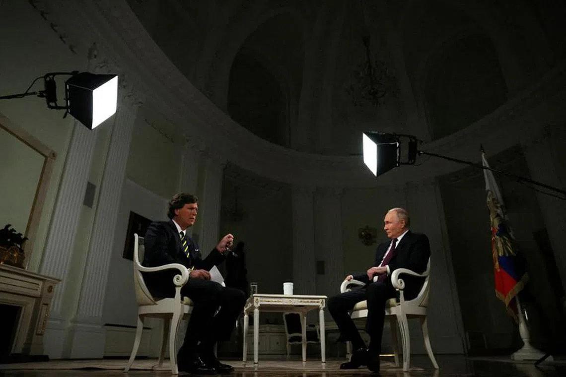 Russian President Vladimir Putin listens during an interview with U.S. television host Tucker Carlson in Moscow, Russia February 6, 2024. Sputnik/Gavriil Grigorov/Kremlin via REUTERS