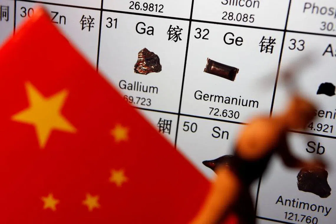 File photo: The flag of China and a worker miniature are placed next to the elements of Gallium and Germanium on a periodic table, in this illustration picture taken on July 6, 2023. REUTERS/Florence Lo/Illustration/File photo