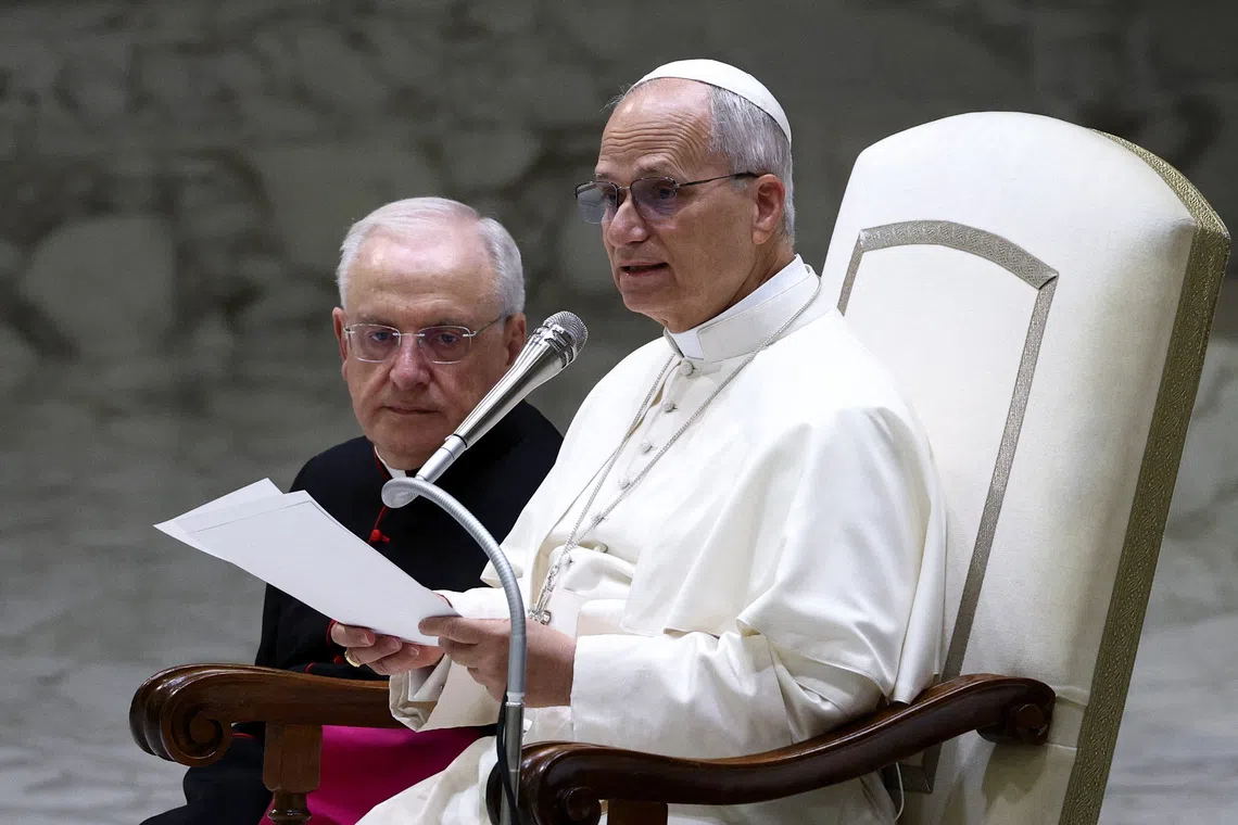 Pope Leo XIV speaks as he meets with members of the Equestrian Order of the Holy Sepulchre of Jerusalem at the Vatican, October 23, 2025. REUTERS/Guglielmo Mangiapane