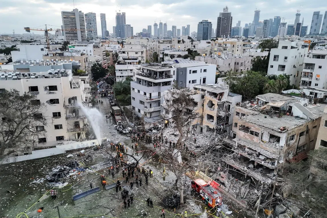 FILE PHOTO: A drone photo shows the damage over residential homes at the impact site following missile attack from Iran on Israel, in Tel Aviv, Israel June 16, 2025. REUTERS/Moshe Mizrahi/File Photo