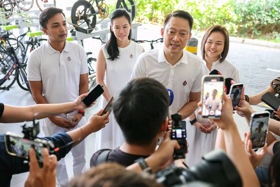 (From left) Dr Elmie Nekmat, Ms Bernadette Giam, Dr Lam Pin Min and Ms Theodora Lai speaking to the media before their walkabout at Rivervale Shores on March 30.