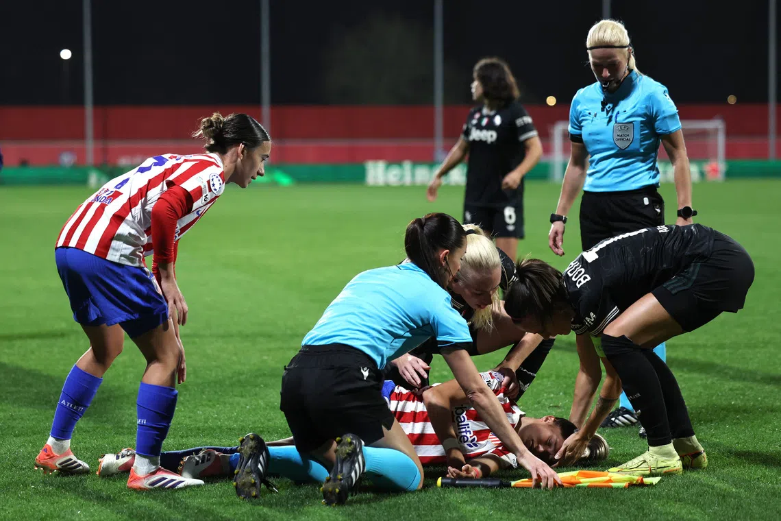 Soccer Football - UEFA Women's Champions League - Atletico Madrid v Juventus - Centro Deportivo Alcala de Henares, Madrid, Spain - November 12, 2025 Atletico Madrid's Andrea Medina after sustaining an injury REUTERS/Violeta Santos Moura