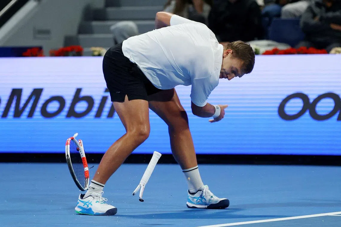 Serbia's Hamad Medjedovic smashes his racket during his round of 32 match against Greece's Stefanos Tsitsipas Tennis at the Qatar Open, held at the Khalifa International Tennis and Squash Complex, in Doha, Qatar on Feb 18, 2025 