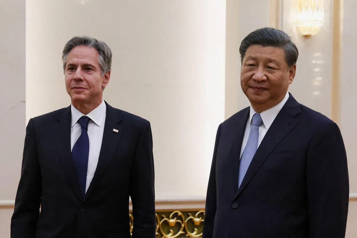 US Secretary of State Antony Blinken (left) and China's President Xi Jinping before their meeting at the Great Hall of the People in Beijing on June 19.
