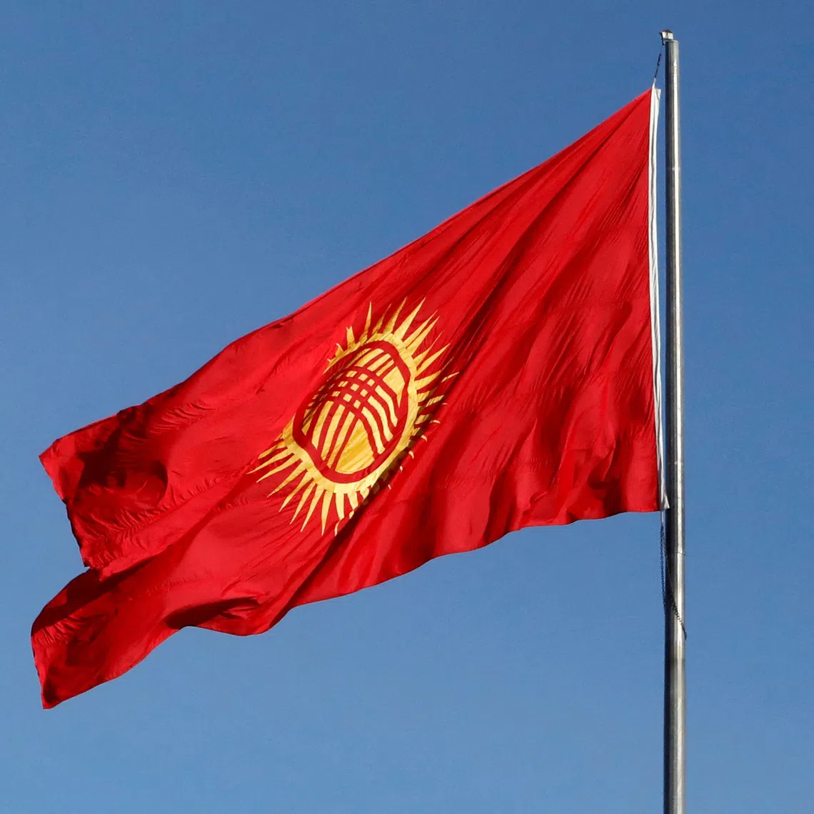 A view shows the renewed Kyrgyz national flag during a ceremony in Bishkek, Kyrgyzstan, January 1, 2024. REUTERS/Vladimir Pirogov/File Photo