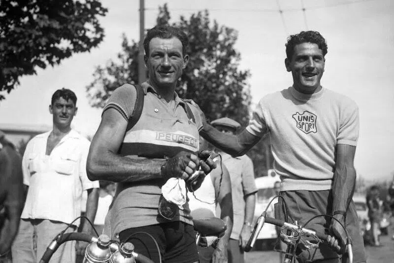 French cyclist Charles Coste (right) poses with an unidentified rider in July 1950 during the 37th edition of the Tour de France.