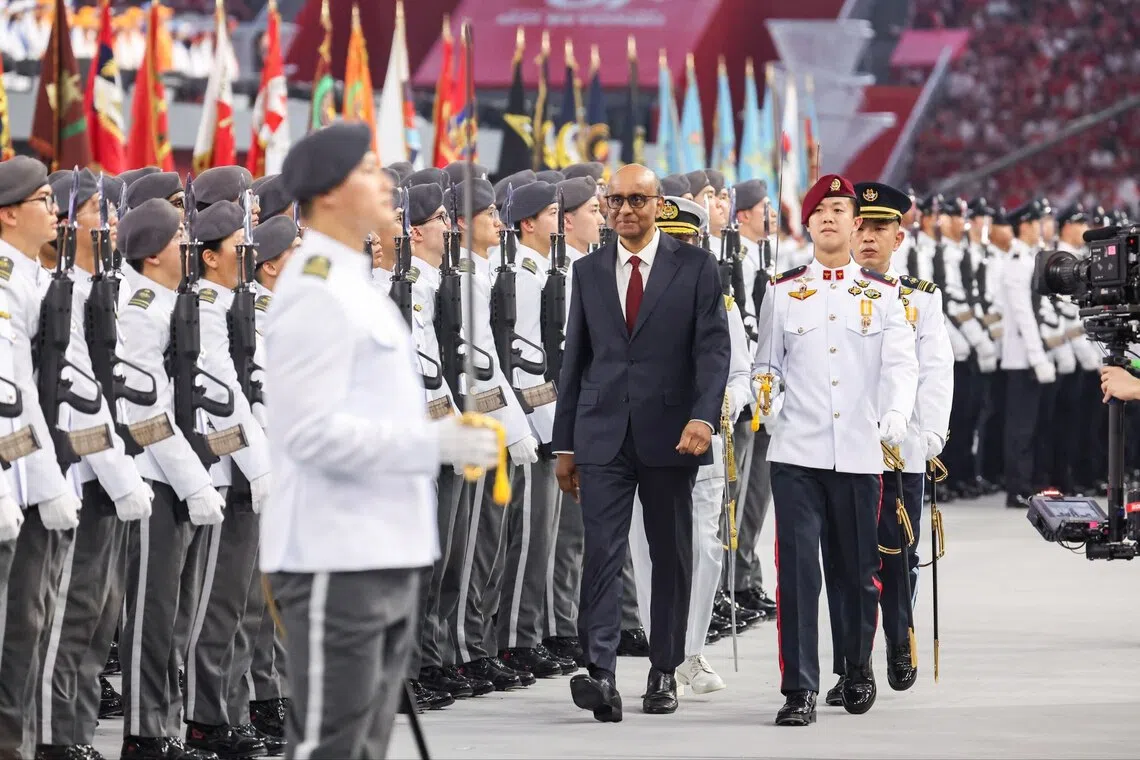 President Tharman Shanmugaratnam inspecting the guard-of-honour contingents during National Day Parade 2026 at the National Stadium on Aug 9. The parade was led by parade commander Caleb Chia (right, in red beret) of the Republic of Singapore Air Force.