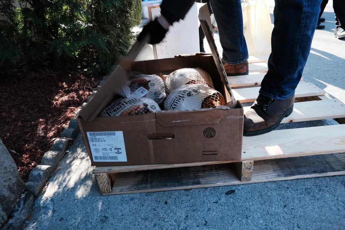 Free Thanksgiving turkeys are distributed at the Holy Innocents Roman Catholic Church in Brooklyn on Nov 21 in New York City.