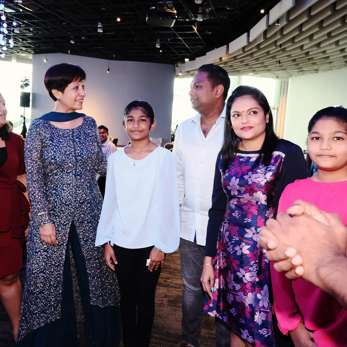 Minister in the Prime Minister’s Office Indranee Rajah (second from left) with Sinda beneficiaries at Sinda’s appreciation tea on Jan 21.