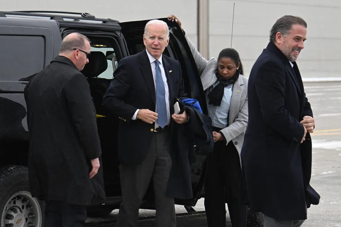 US President Joe Biden (left) and son Hunter Biden (right) arrive to board Air Force One in Syracuse, New York, on Feb 4, 2023.