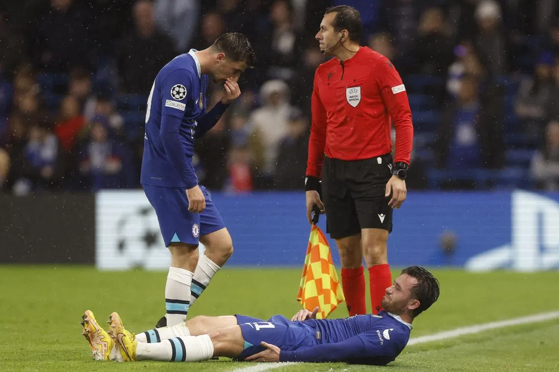 Chelsea's Ben Chilwell is down injured as Mason Mount looks on during the Champions League game against Zagreb.