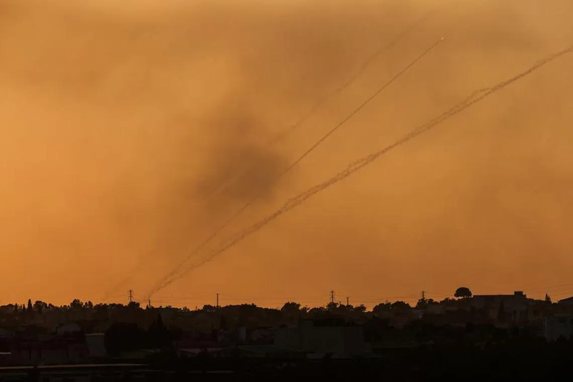 Rockets are launched from the Gaza Strip towards Israel, as seen from near Israel's border with Gaza in southern Israel, October 12, 2023. REUTERS/Amir Cohen