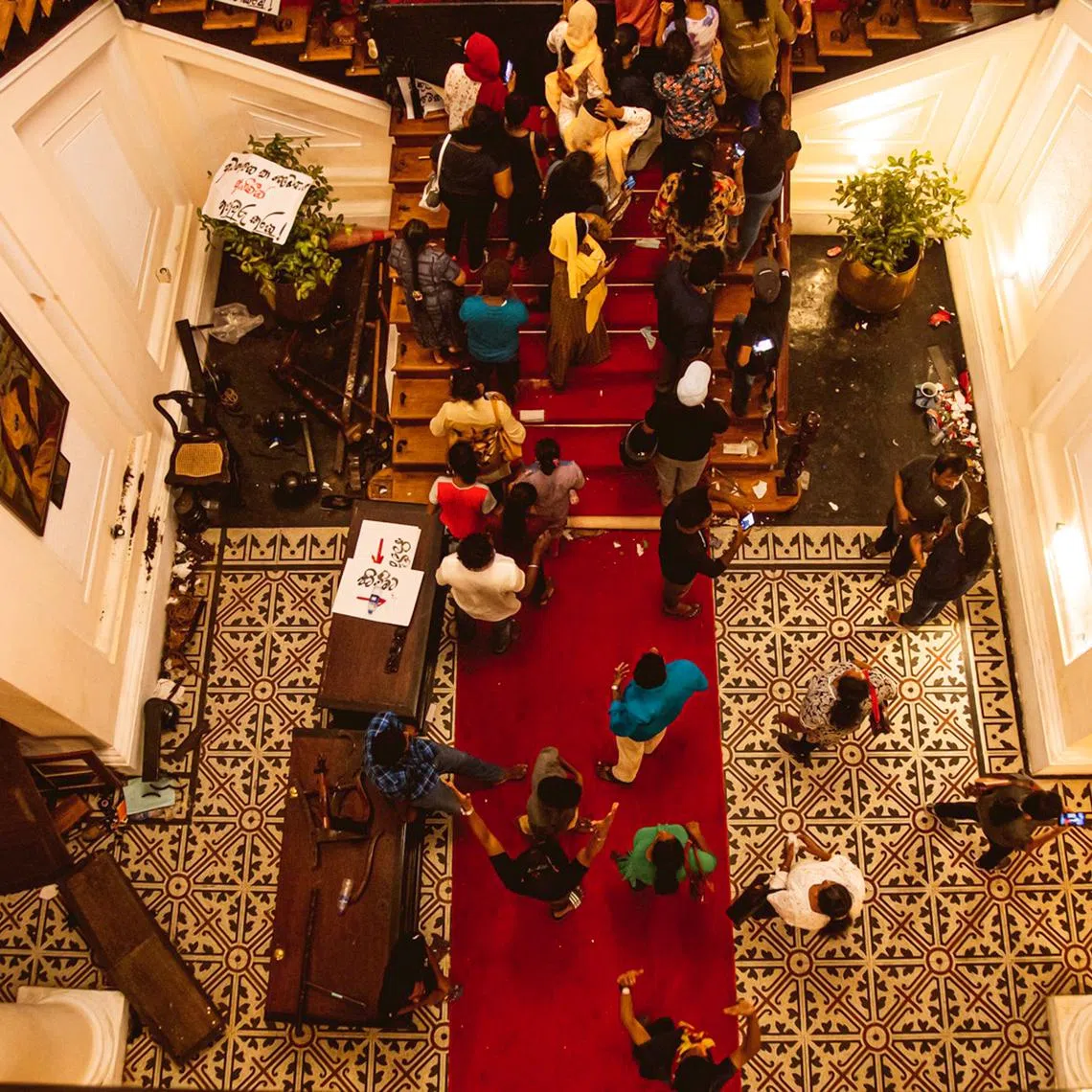 Sri Lankan protestors taking over the Presidential palace after President Gotabaya Rajapaksa fled the country.