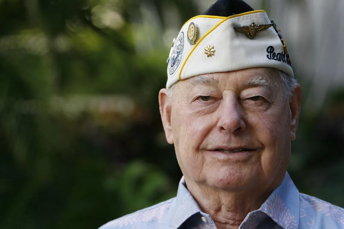 Pearl Harbor survivor Louis Conter poses for the camera at the Hale Koa hotel in Honolulu, Hawaii December 4, 2010. REUTERS/Hugh Gentry/ File Photo