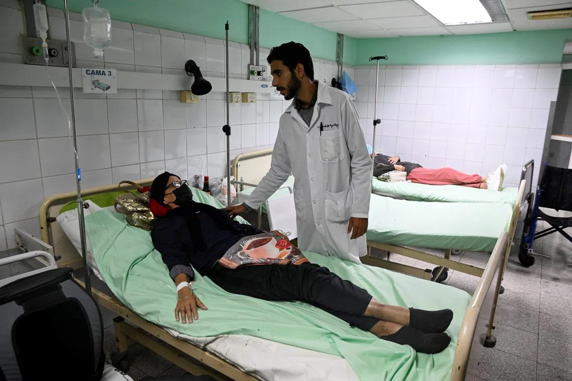 A doctor talks to a patient at a public hospital, as Cuba’s once-vaunted healthcare system, long hailed as a cornerstone of the 1959 revolution, has deteriorated amid years of economic crisis and U.S. sanctions, a decline that has accelerated this year with U.S. restrictions on oil supplies, in Havana, Cuba, March 18, 2026. REUTERS/Norlys Perez