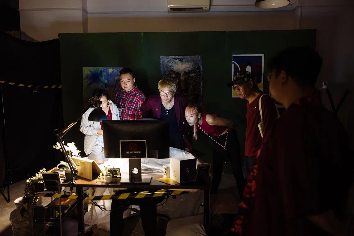 Audiences are encouraged to wander around the space looking for clues about who committed the murder in Red: An Artful Murder.