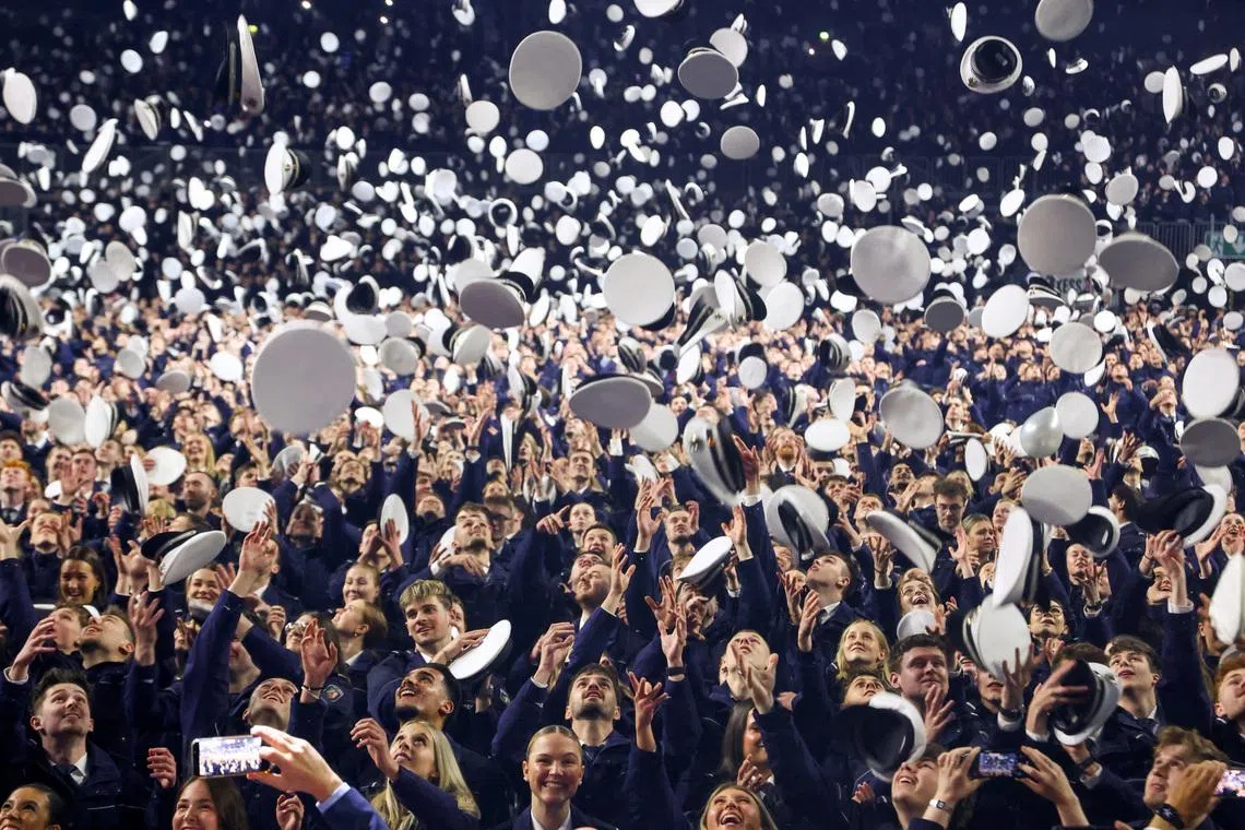 Police trainees throw their hats into the air during a swearing-in ceremony in Cologne, Germany, April 15, 2026. REUTERS/Thilo Schmuelgen TPX IMAGES OF THE DAY