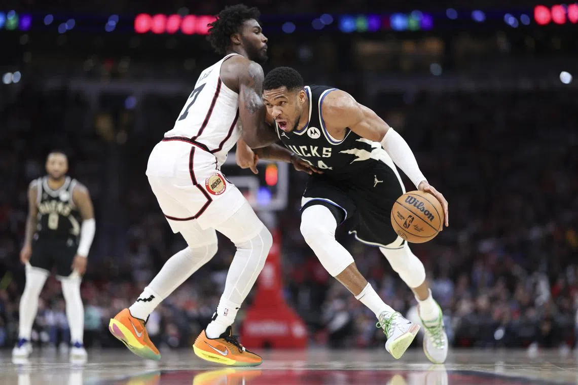 Milwaukee Bucks forward Giannis Antetokounmpo drives with the ball as Houston Rockets forward Tari Eason defends during the third quarter at Toyota Centre.