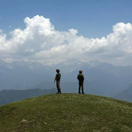 Soldiers standing guard near the Line of Control, a de facto boundary separating the Indian and Pakistani armies, in the Poonch sector of India‘s Jammu region.