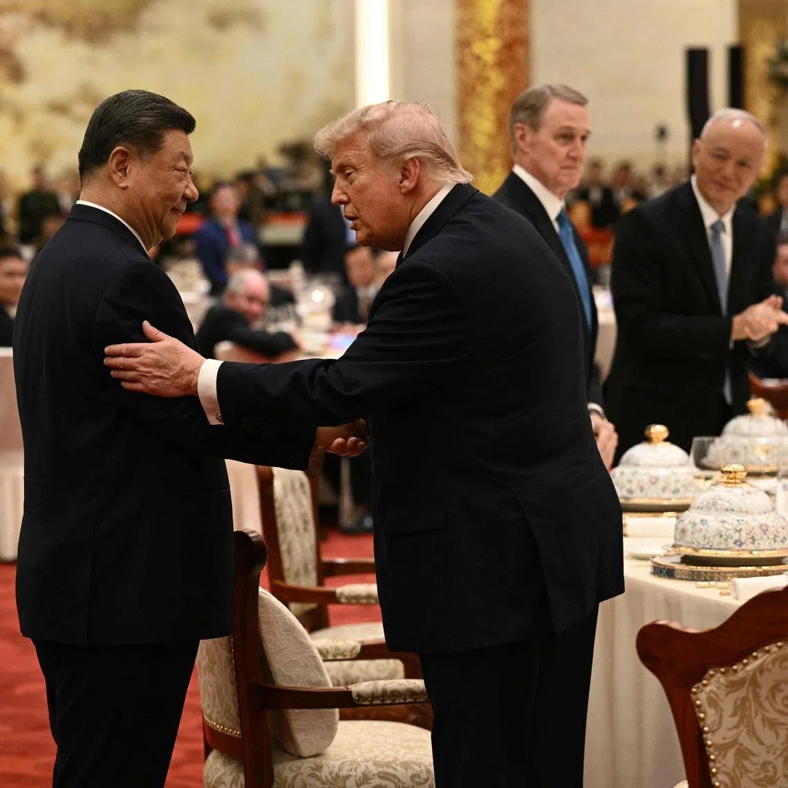 China's President Xi Jinping (left) and US President Donald Trump attend a state banquet at the Great Hall of the People in Beijing, on May 14.