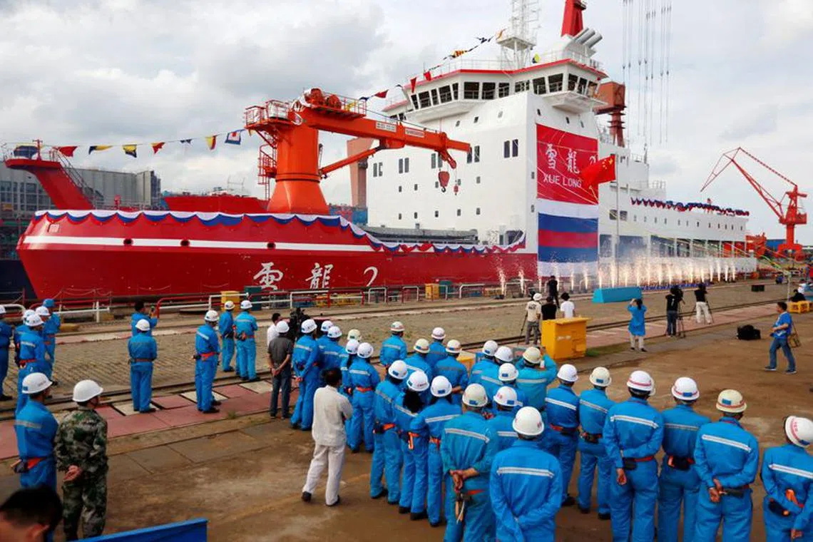 FILE PHOTO: People attend the launch ceremony of China's first domestically built polar icebreaker Xuelong 2, or Snow Dragon 2, at a shipyard in Shanghai, China September 10, 2018. Picture taken September 10, 2018. REUTERS/Stringer/File Photo