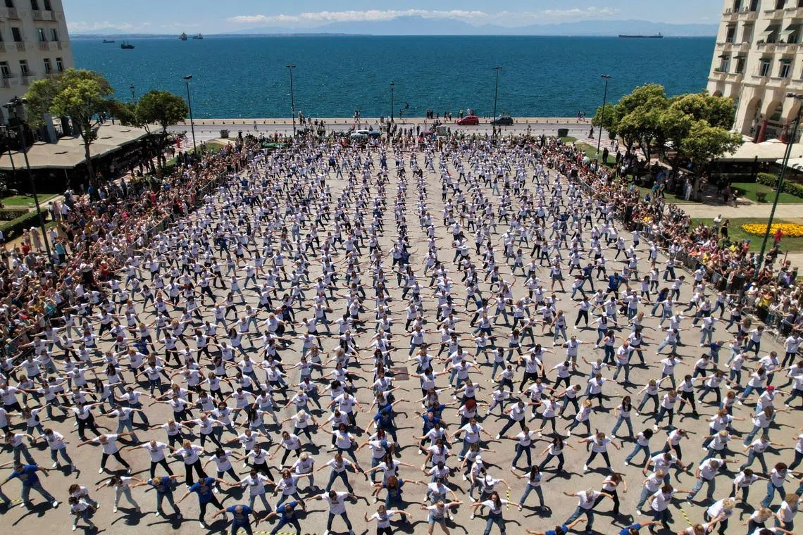 Hundreds of  of participants performing a synchronized zeibekiko, a traditional solo Greek dance, in an effort to set a news Guinness World Record, in Thessaloniki, Greece, on June 14, 2026. 