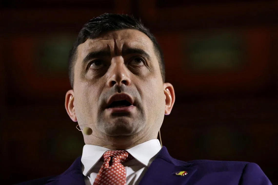 FILE PHOTO: Far-right opposition leader and presidential candidate George Simion answers questions during a press conference, in Bucharest, Romania, April 11, 2025. Inquam Photos/Sabin Cirstoveanu via REUTERS/File Photo