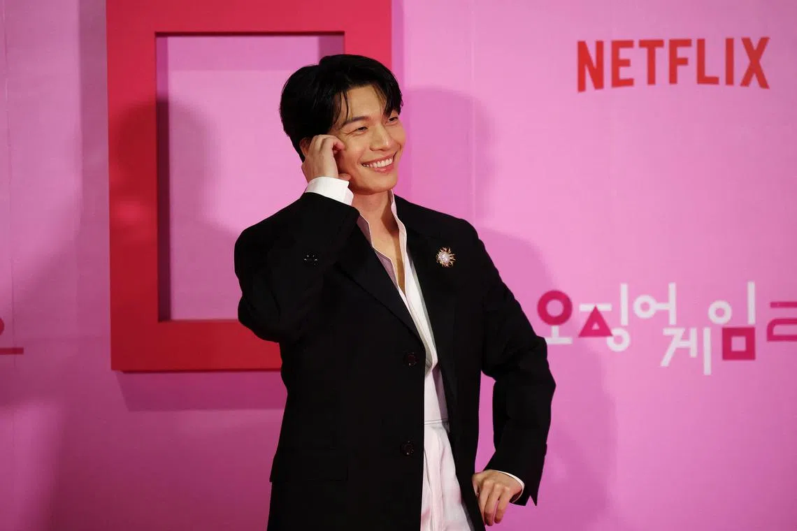 South Korean actor Wi Ha-joon poses for photographs during the global premiere of the Netflix series "Squid Game Season 2" in Seoul, South Korea, December 9, 2024. REUTERS/Kim Hong-Ji