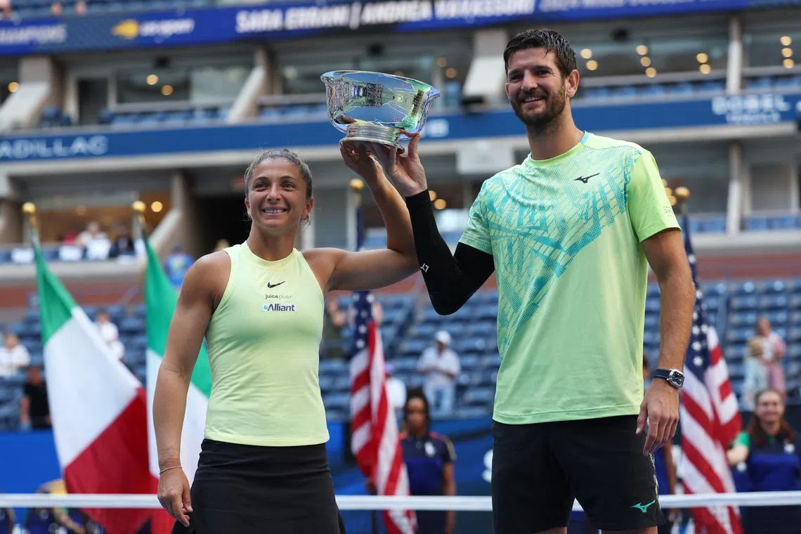 Tennis - U.S. Open - Flushing Meadows, New York, United States - September 5, 2024 Italy's Sara Errani and Andrea Vavassori celebrate after winning their mixed doubles final against Taylor Townsend and Donald Young of the U.S. REUTERS/Mike Segar