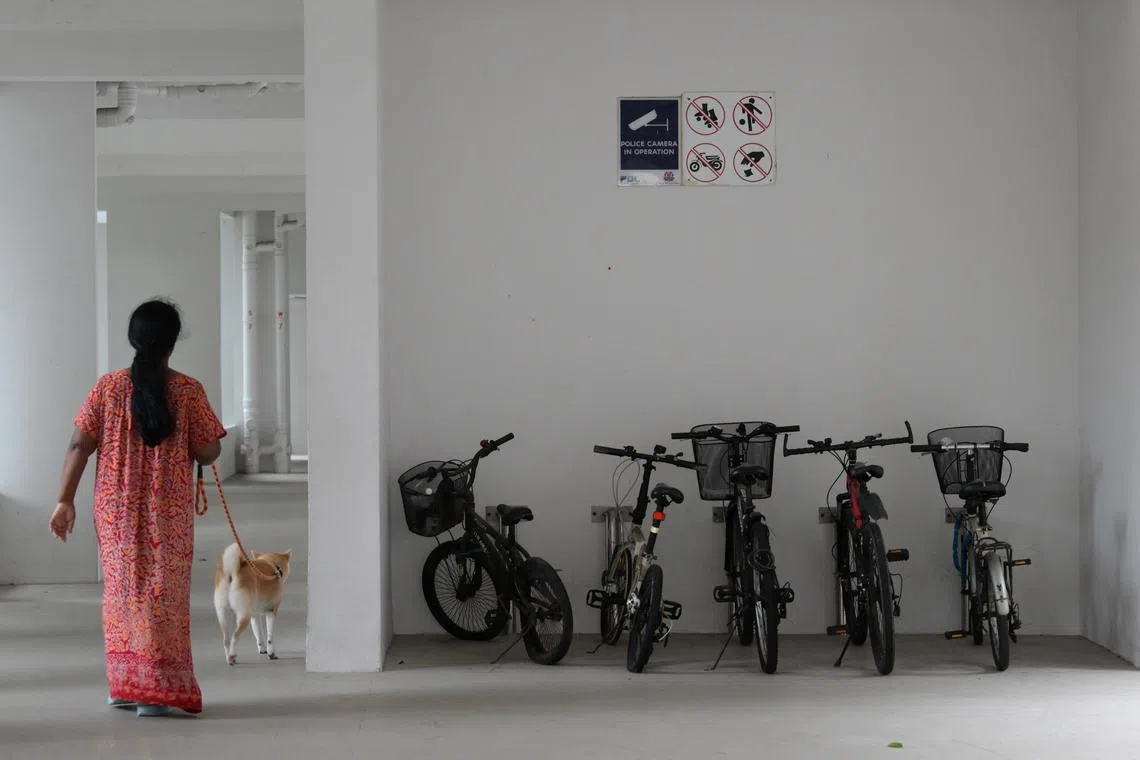 A sign indicating that football is not allowed, among other signs, at a void deck of an HDB block.
