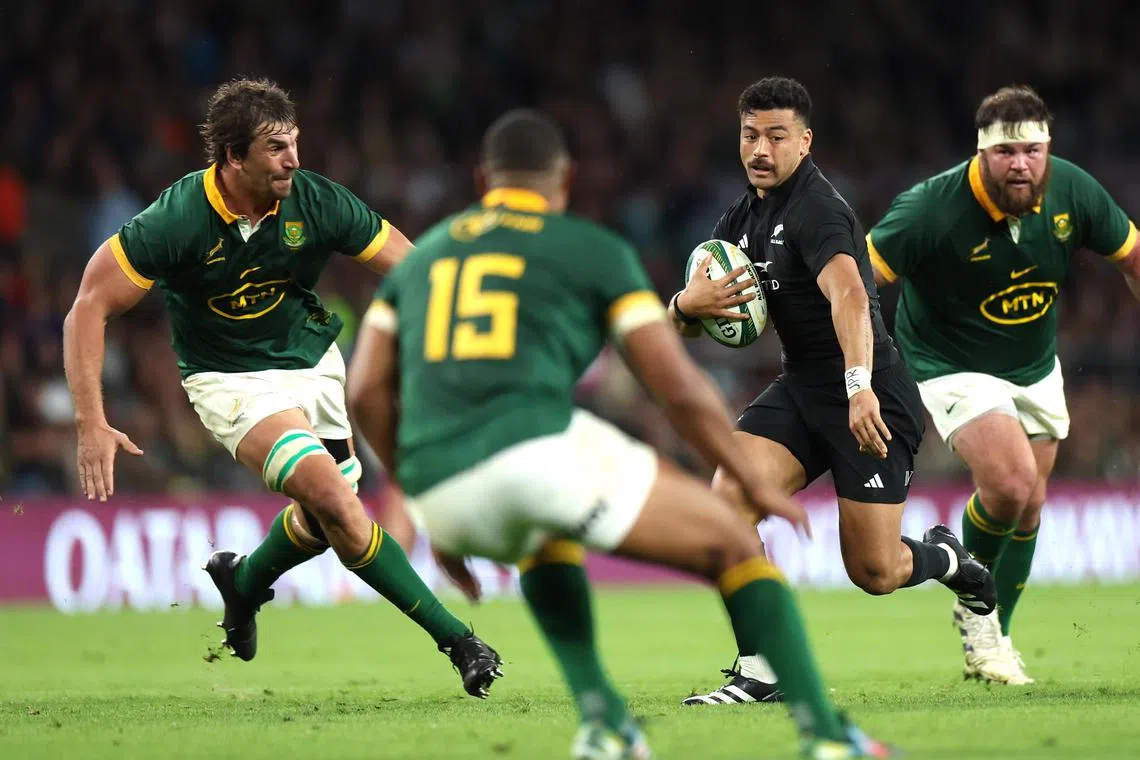 Manie Libbok of New Zealand is surrounded by South African players during their rugby test match on Aug 25 in Twickenham. The All Blacks lost 35-7 in their final warm-up before the World Cup.