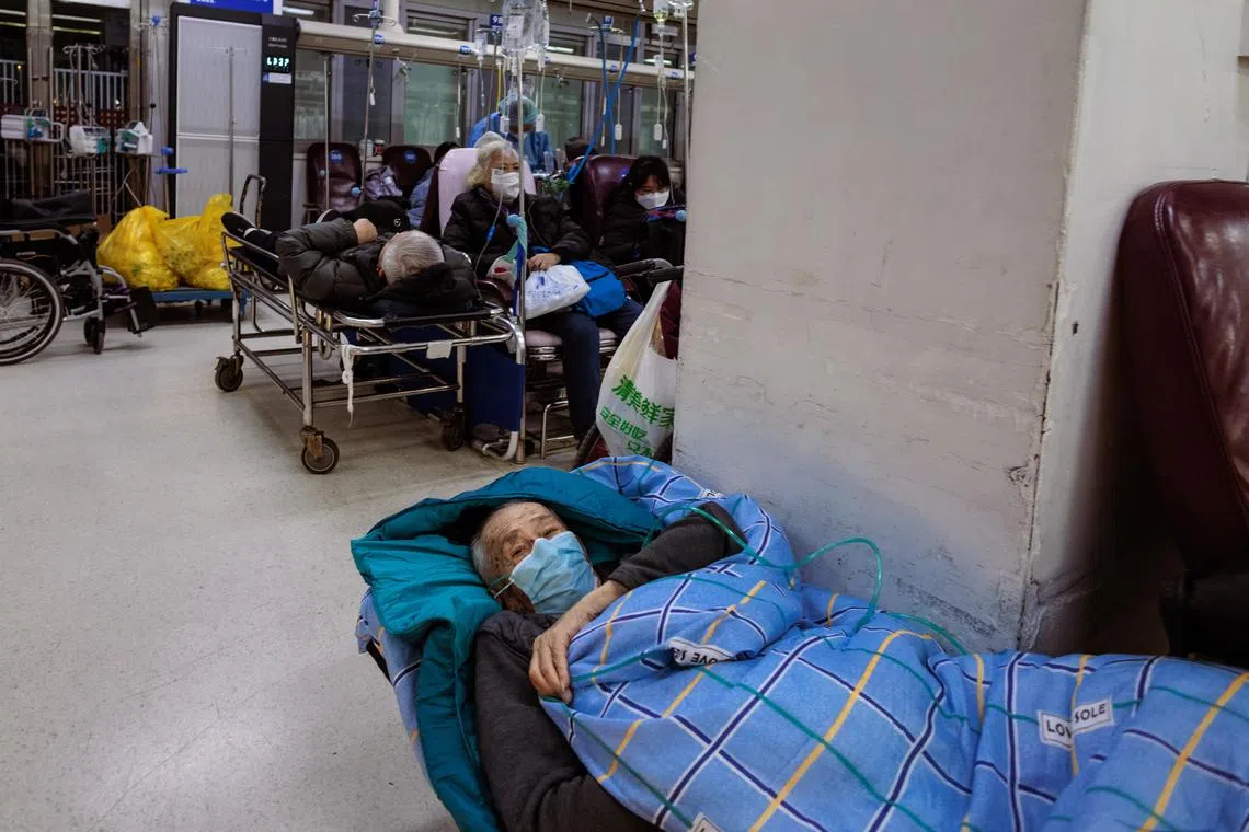A man lays on a stretcher in an emergency room of a hospital in Shanghai, China, on Jan 15, 2023. 
