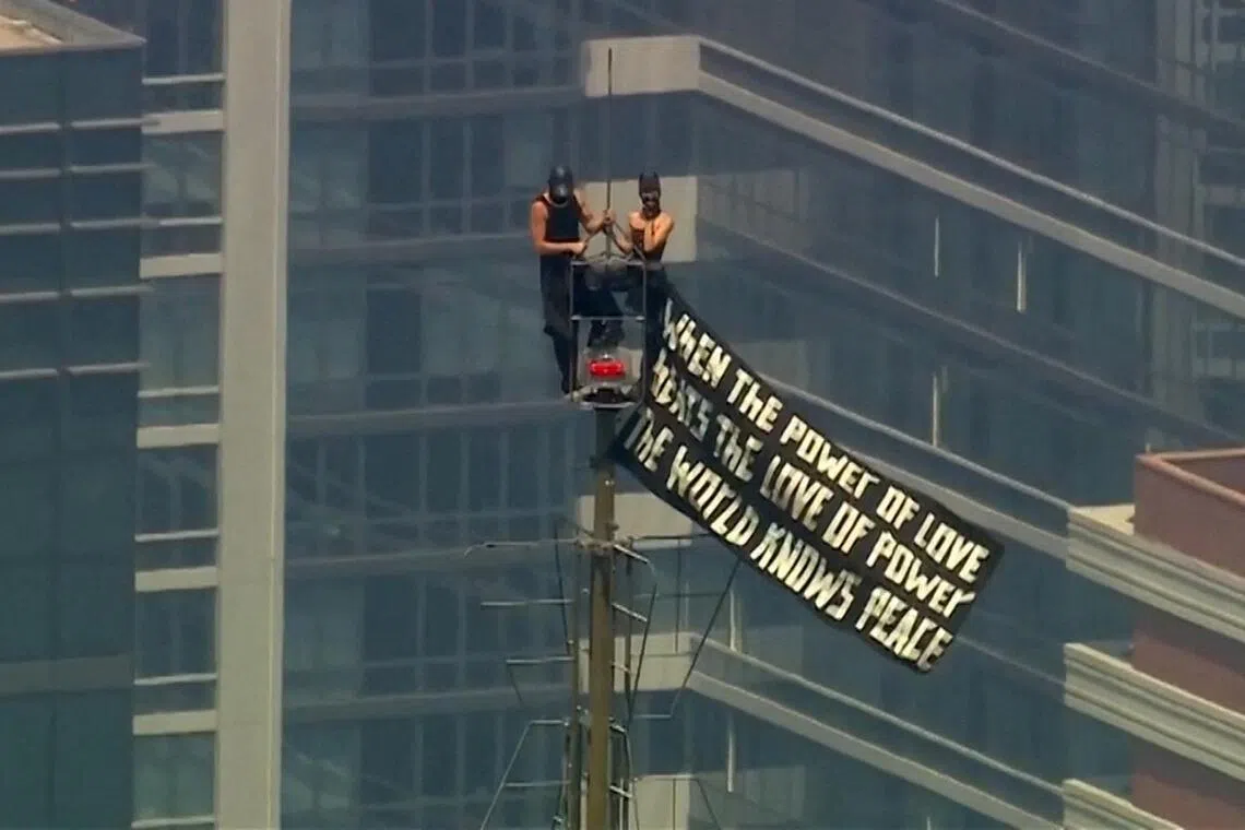 The couple unfurled a banner with a message about love and got engaged as news helicopters whirled around them.