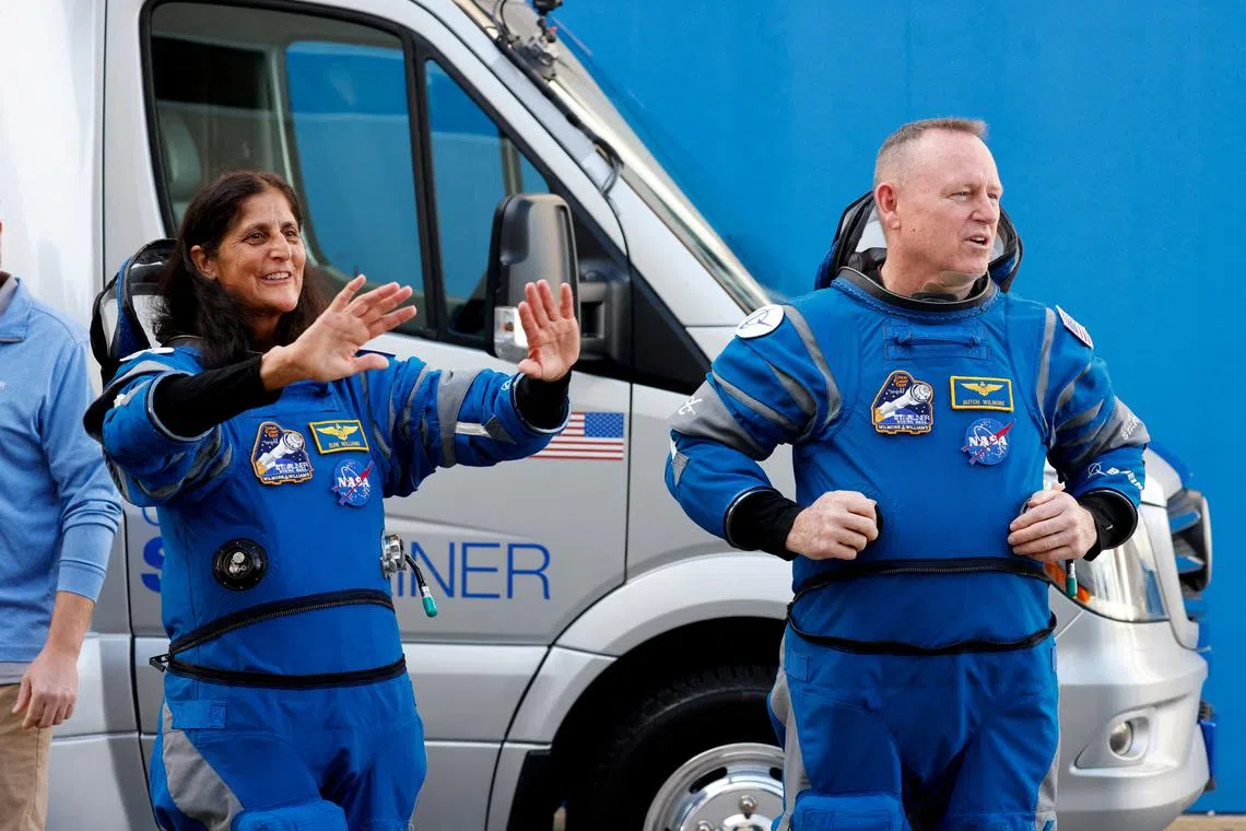 FILE PHOTO: NASA astronauts Butch Wilmore and Suni Williams stand at NASA's Kennedy Space Center, on the day of Boeing's Starliner-1 Crew Flight Test (CFT) mission on a United Launch Alliance Atlas V rocket to the International Space Station, in Cape Canaveral, Florida, U.S., June 1, 2024. REUTERS/Joe Skipper/File Photo