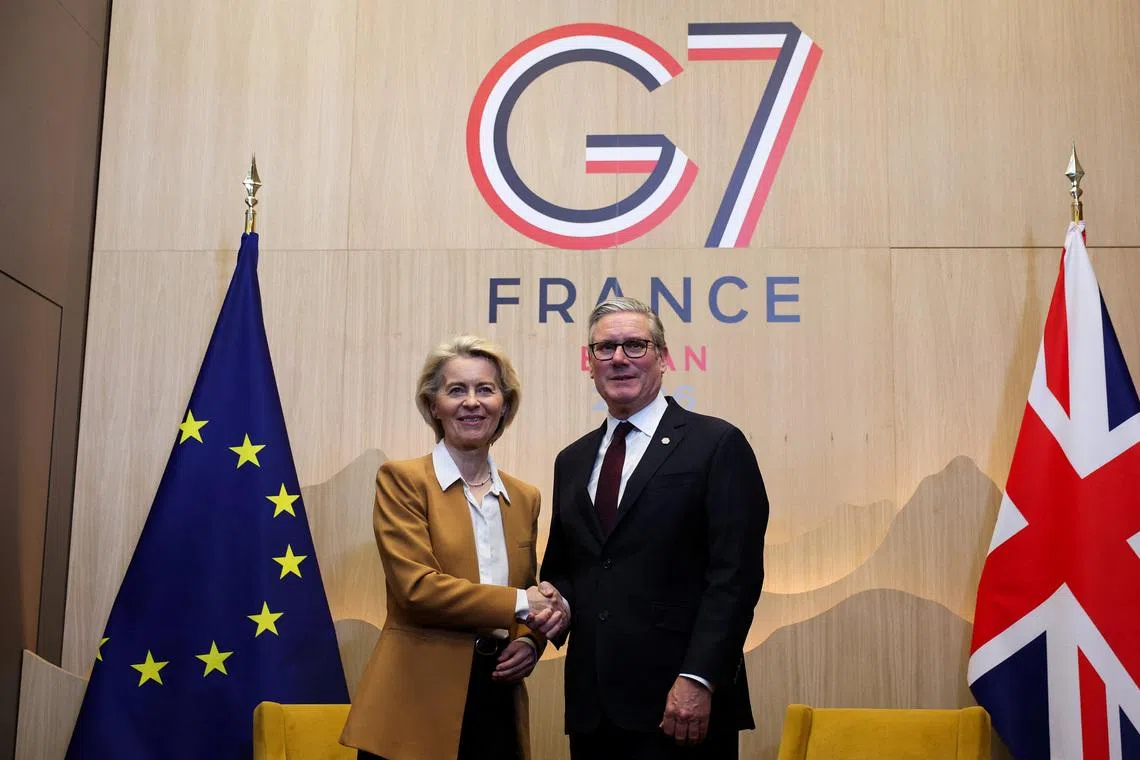 British Prime Minister Keir Starmer and European Commission President Ursula von der Leyen shake hands as they meet, on the sidelines of the G7 summit, in Evian-les-Bains in France, June 16, 2026. REUTERS/Isabel Infantes/Pool